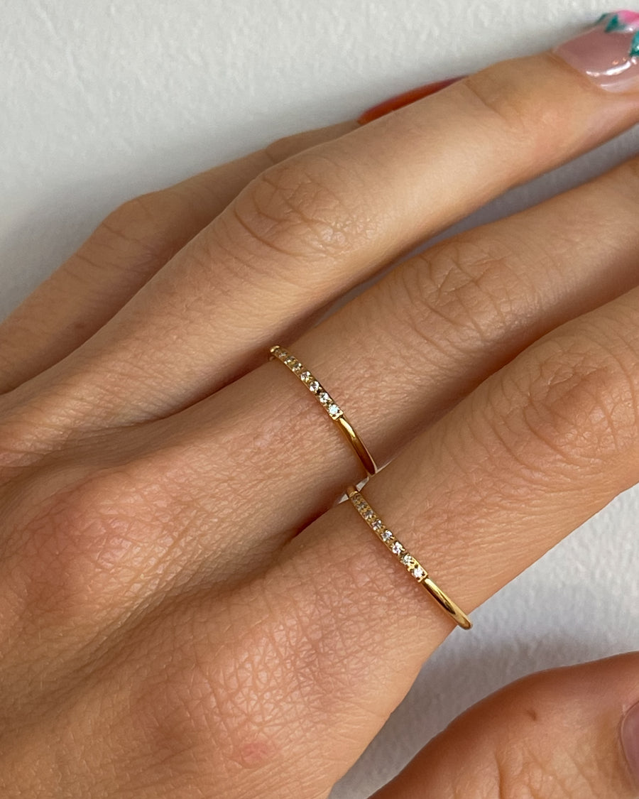 Minimalist stacking zirconia ring in 18k gold PVD by Tegan Rae Jewellery, showcasing sleek design and sparkling stones.