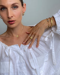 Thumbnail for Tegan Rae Jewellery Lumière Square Cut Crystal Band Ring in 18k gold, featuring a sparkling square-cut crystal design.