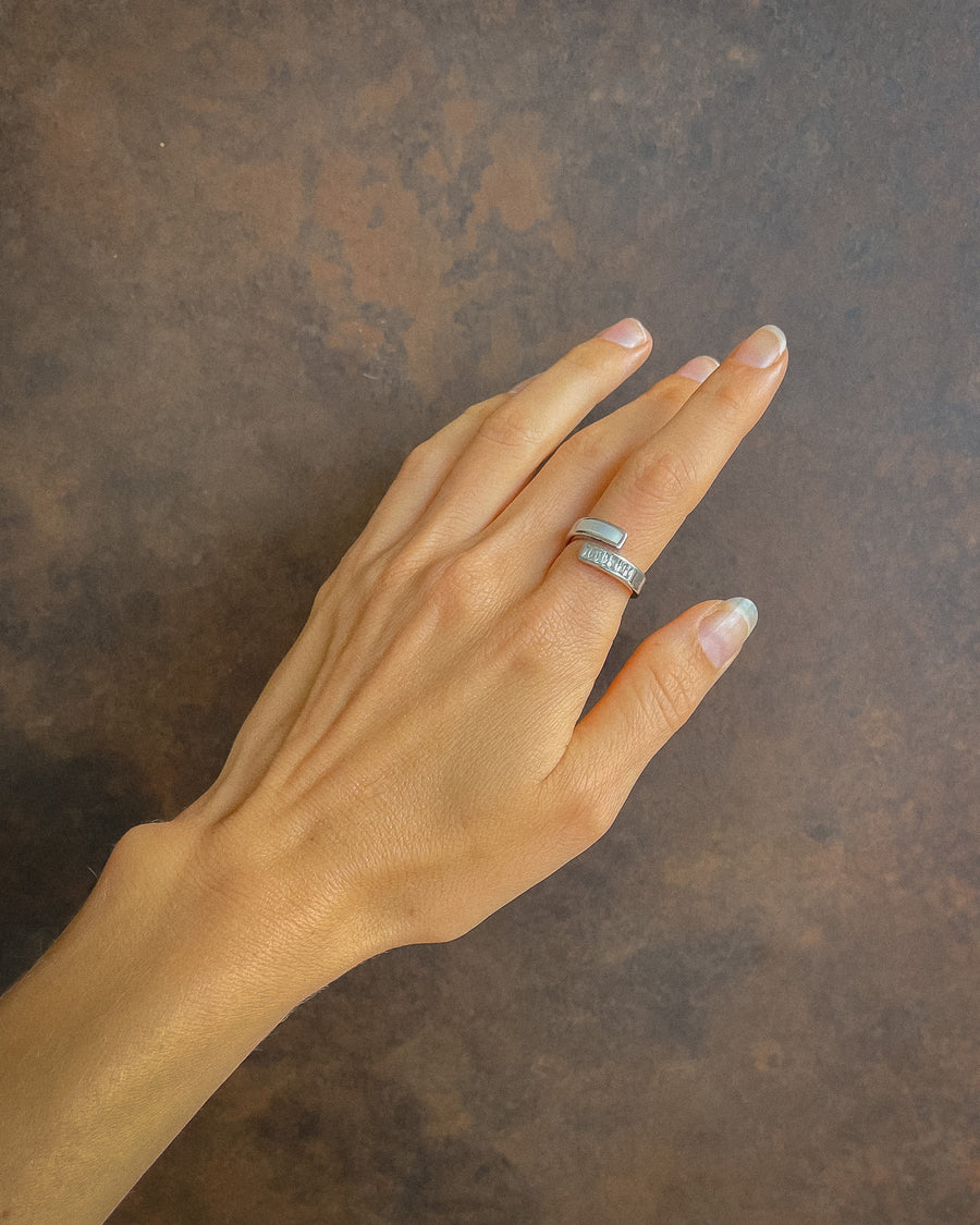 Tegan Rae Jewellery AmAnda white shell and diamond swirl ring in platinum silver, featuring a delicate swirl design and sparkling diamonds.