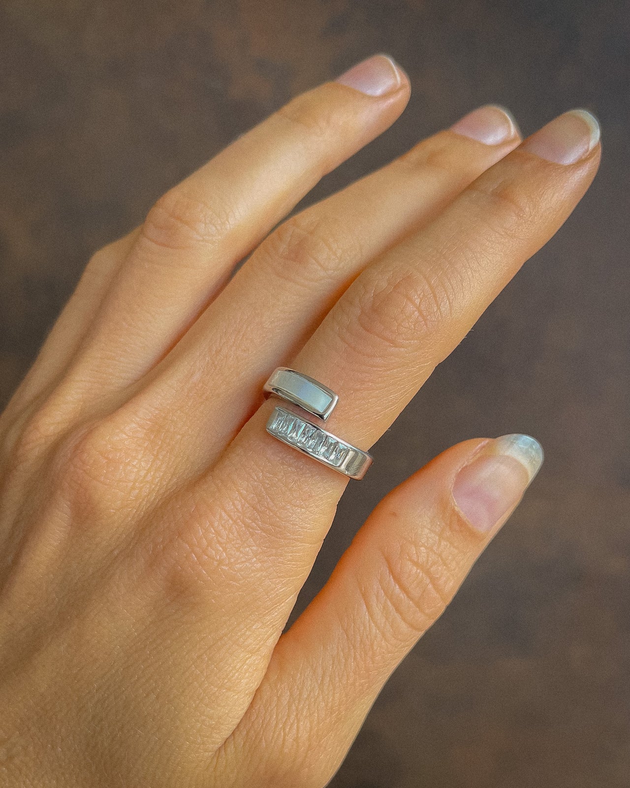 Tegan Rae Jewellery AmAnda White Shell and Diamond Swirl Ring in platinum silver showcasing elegant shell and diamond design.