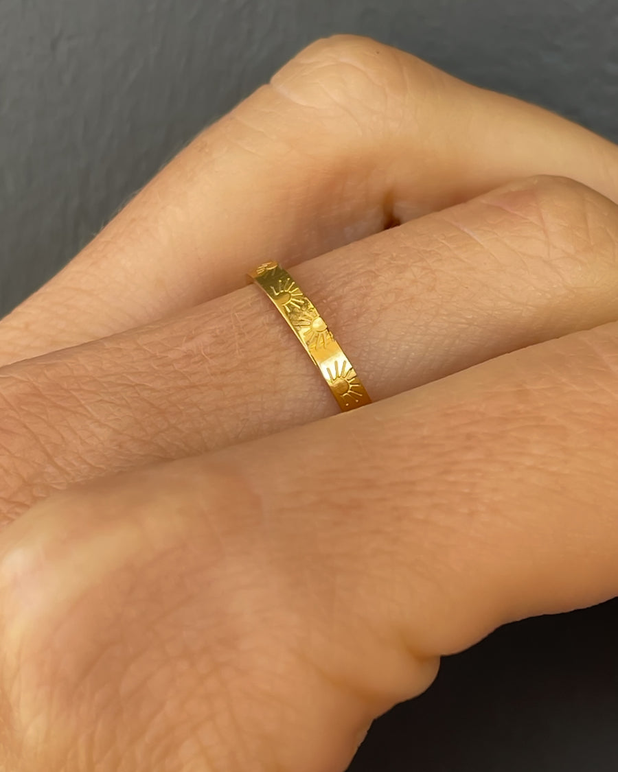 Tegan Rae Jewellery Aura Sun engraved stacking ring in 18k gold PVD, featuring a detailed sun motif on a sleek gold band.