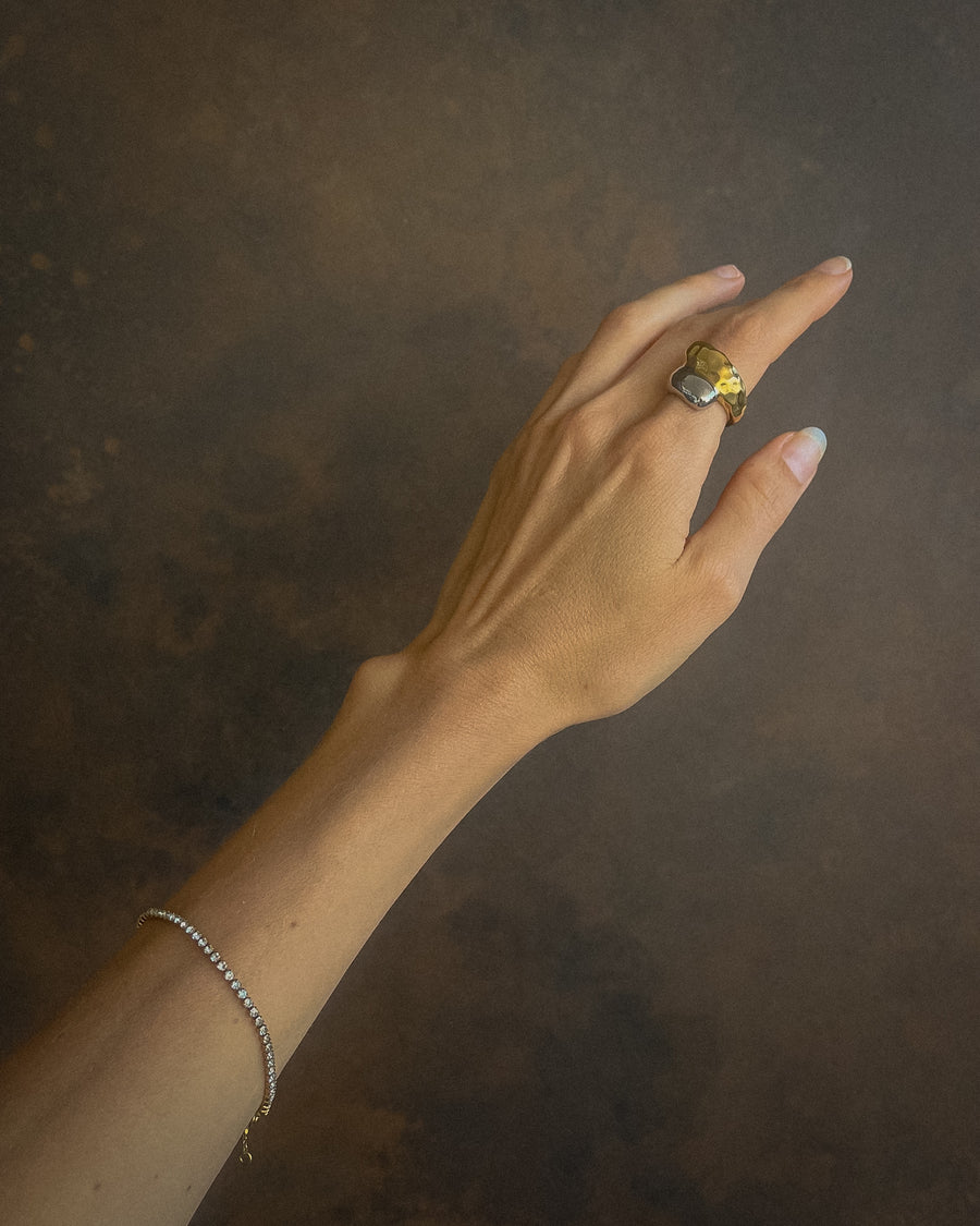 Tegan Rae Jewellery Aurora Two-Tone Dome Ring in platinum silver and gold, showcasing a smooth, rounded design with shiny finish.