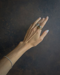 Thumbnail for Gold Luna Curve Band Statement Ring by Tegan Rae Jewelry, showcasing a bold, curved design in close-up view.