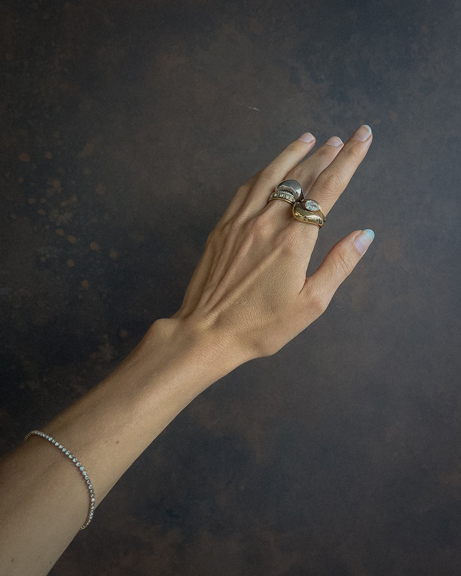 Gold Luna Curve Band Statement Ring by Tegan Rae Jewelry, showcasing a bold, curved design in close-up view.