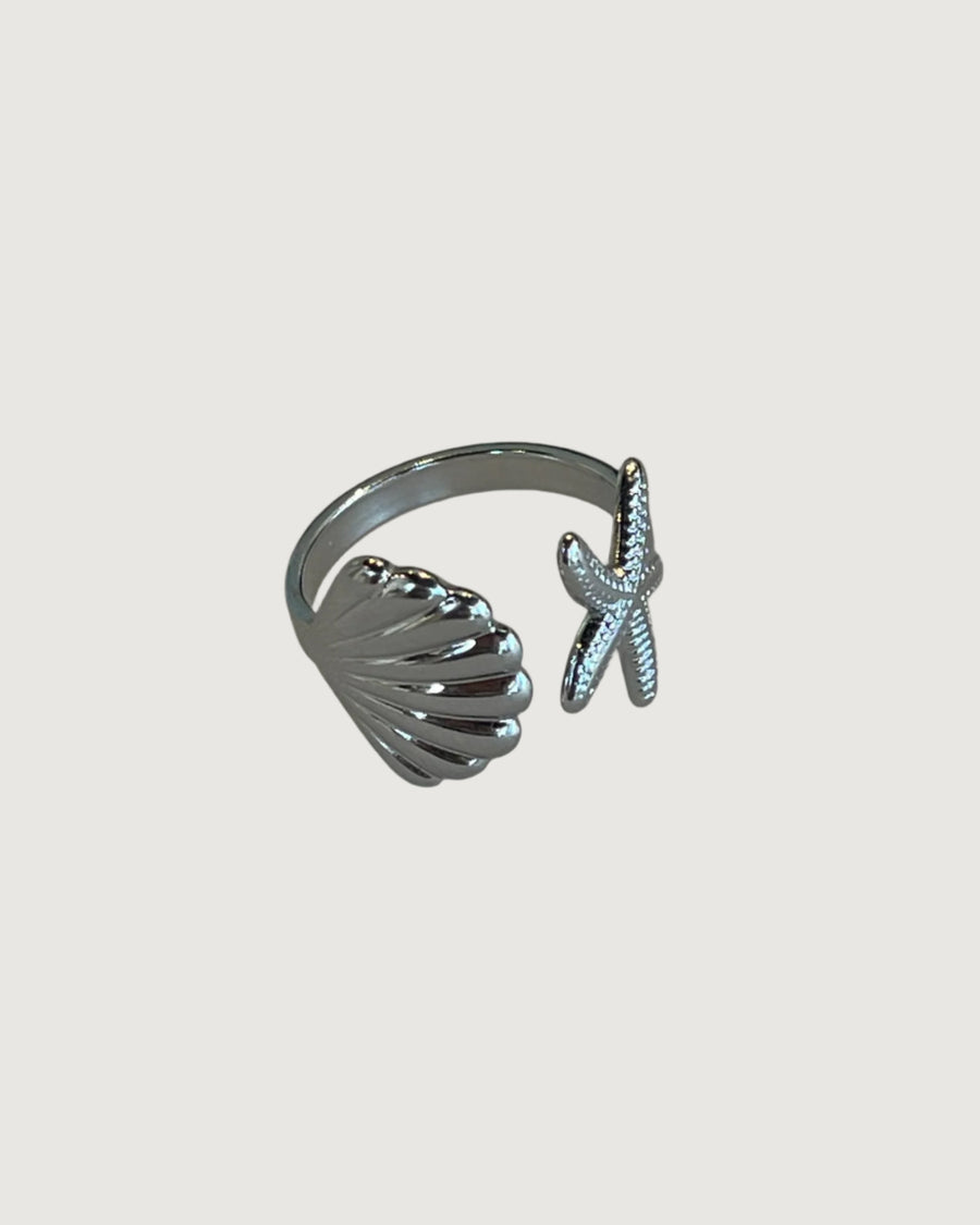 Tegan Rae Jewellery starfish shell tidal charm open ring in platinum silver with intricate ocean-inspired design.