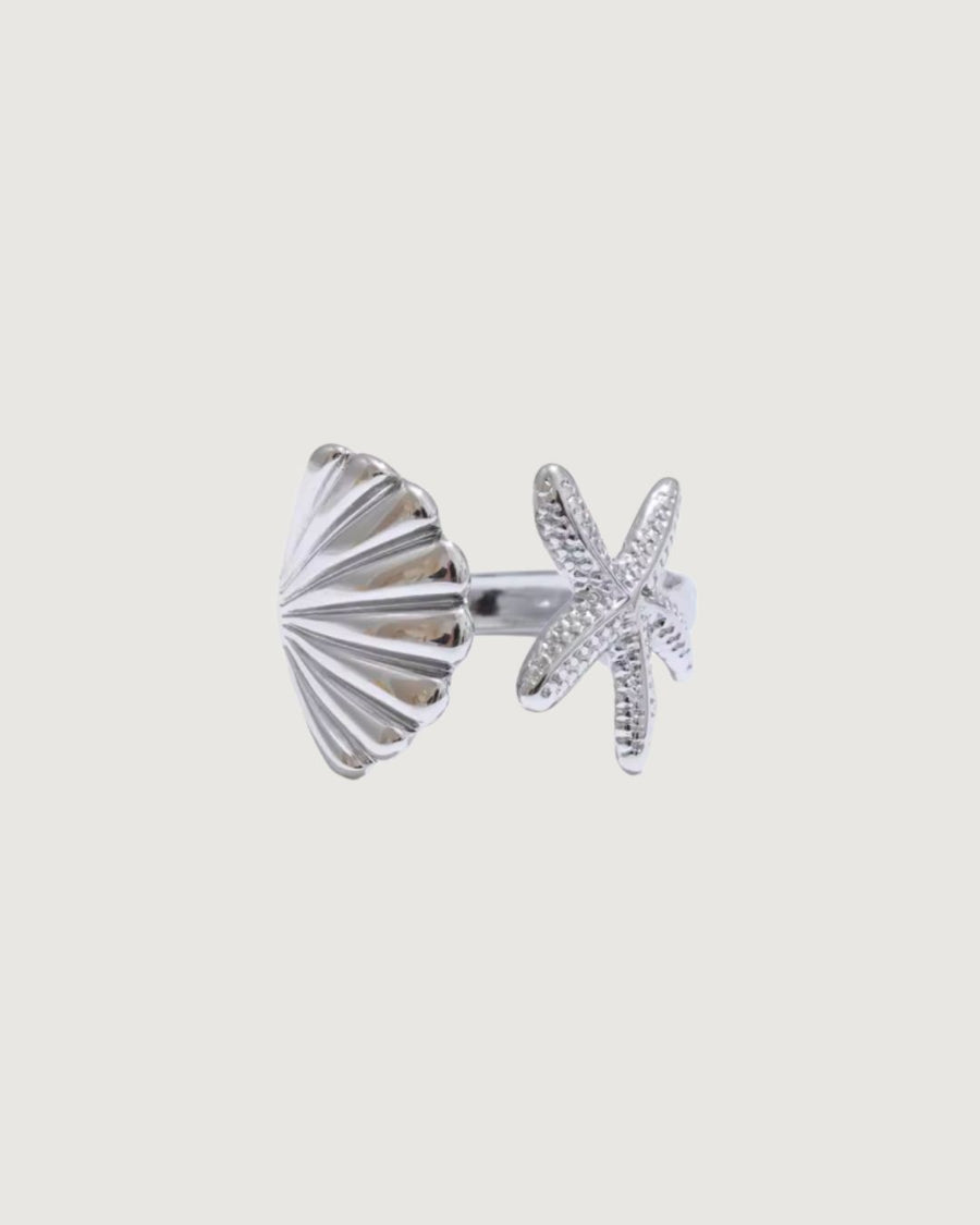 Open starfish shell tidal charm ring in platinum silver by TEGAN RAE JEWELLERY, featuring intricate sea-inspired design.