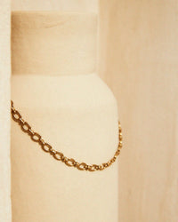Thumbnail for Gold chain necklace on a beige background