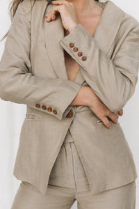 Thumbnail for Close-up of brown corozo buttons on a taupe blazer