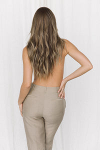 Thumbnail for Back view of model wearing a taupe linen trouser posing in a studio