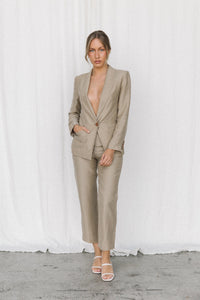 Thumbnail for Model wearing a taupe blazer and trouser in a studio